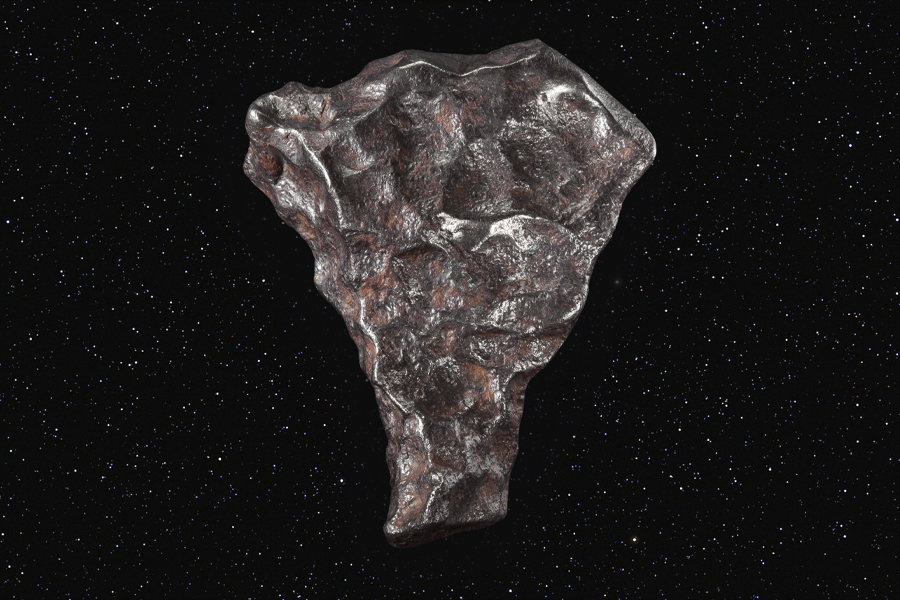 Залізний метеорит з темною кіркою плавлення.